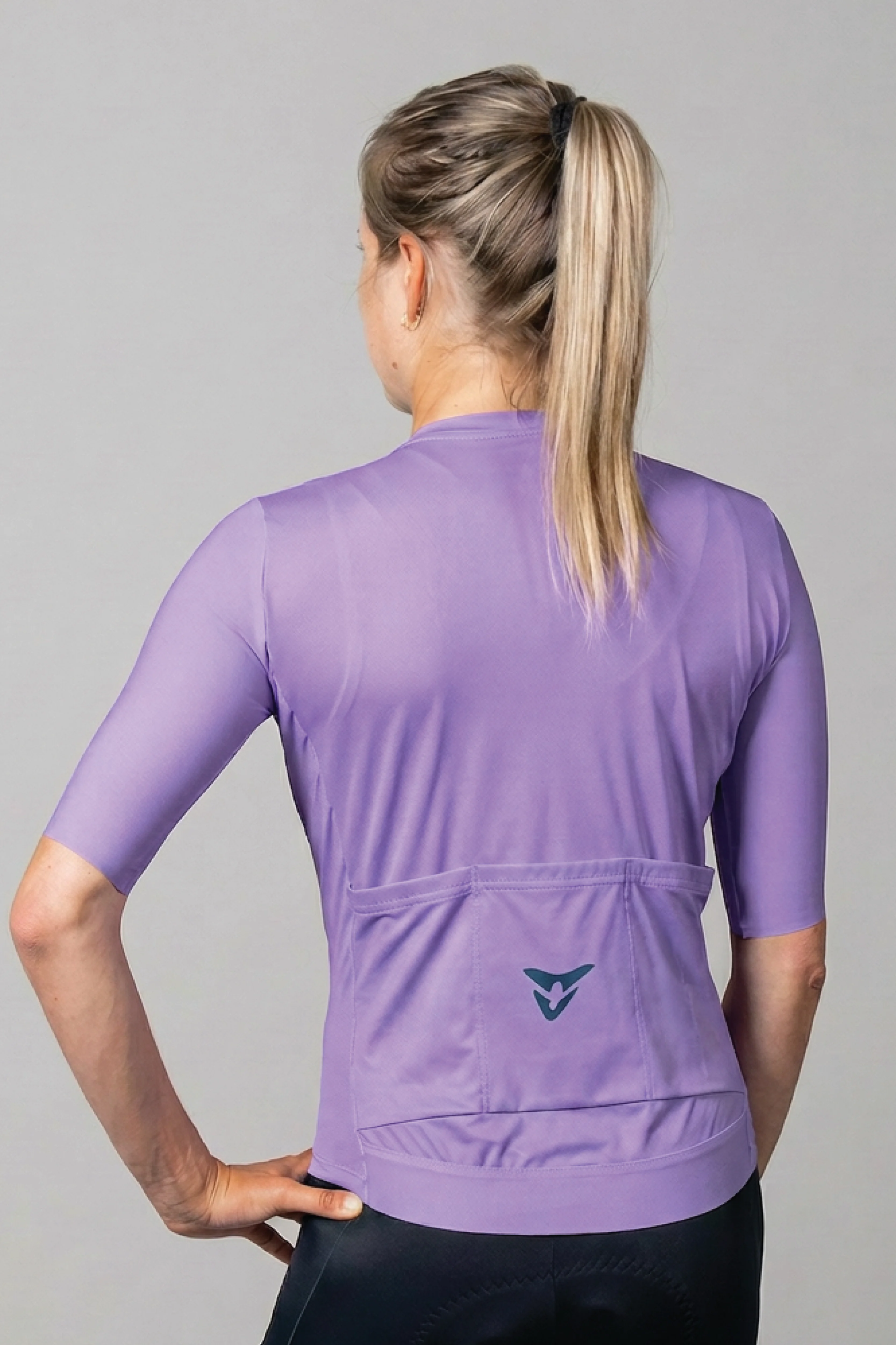 women-s-bronze-comp-jersey-lavender-back.webp